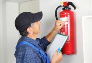 A Professional Checking A fire Extinguisher