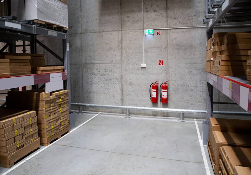 fire extinguishers on wall in warehouse