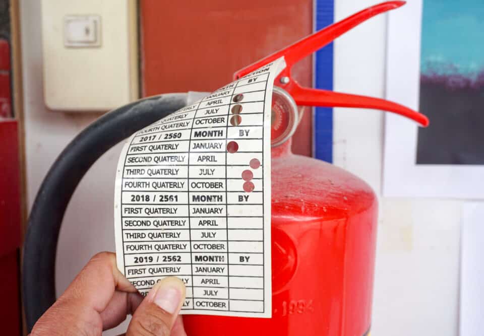 fire extinguisher with information tag.