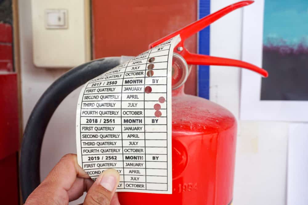 fire extinguisher with information tag.